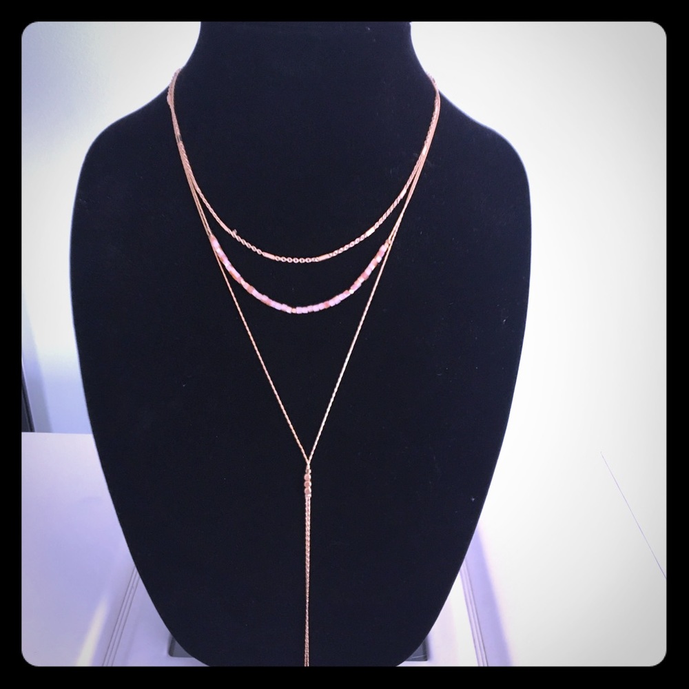 Gold tone tassel necklace w/ matching earrings.